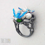 Birds. Oxidised Sterling Silver Ring with Enamel Inserts and Cubic Zirconia by Gigi Cheng. Features natural pearl.