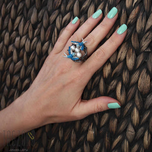 Birds. Oxidised Sterling Silver Ring with Enamel Inserts and Cubic Zirconia by Gigi Cheng. Features natural pearl. Photo on a hand.