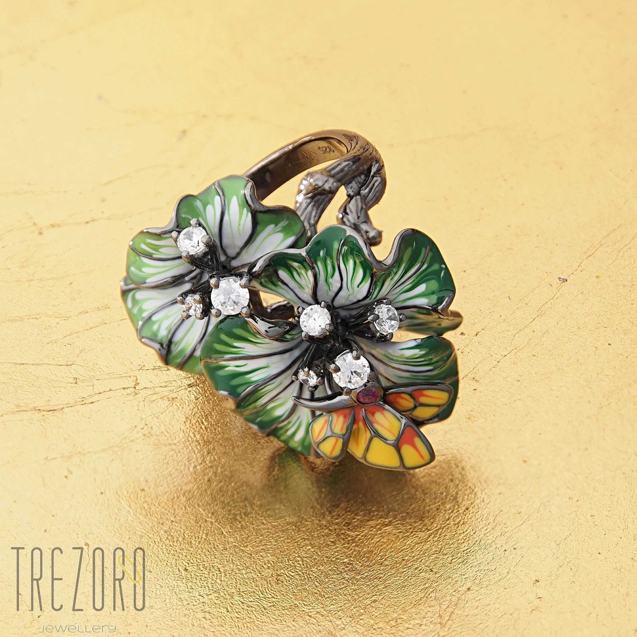 Blossoms Ring. Oxidised sterling silver with enamel inserts and Cubic Zirconia. Photo on gold.