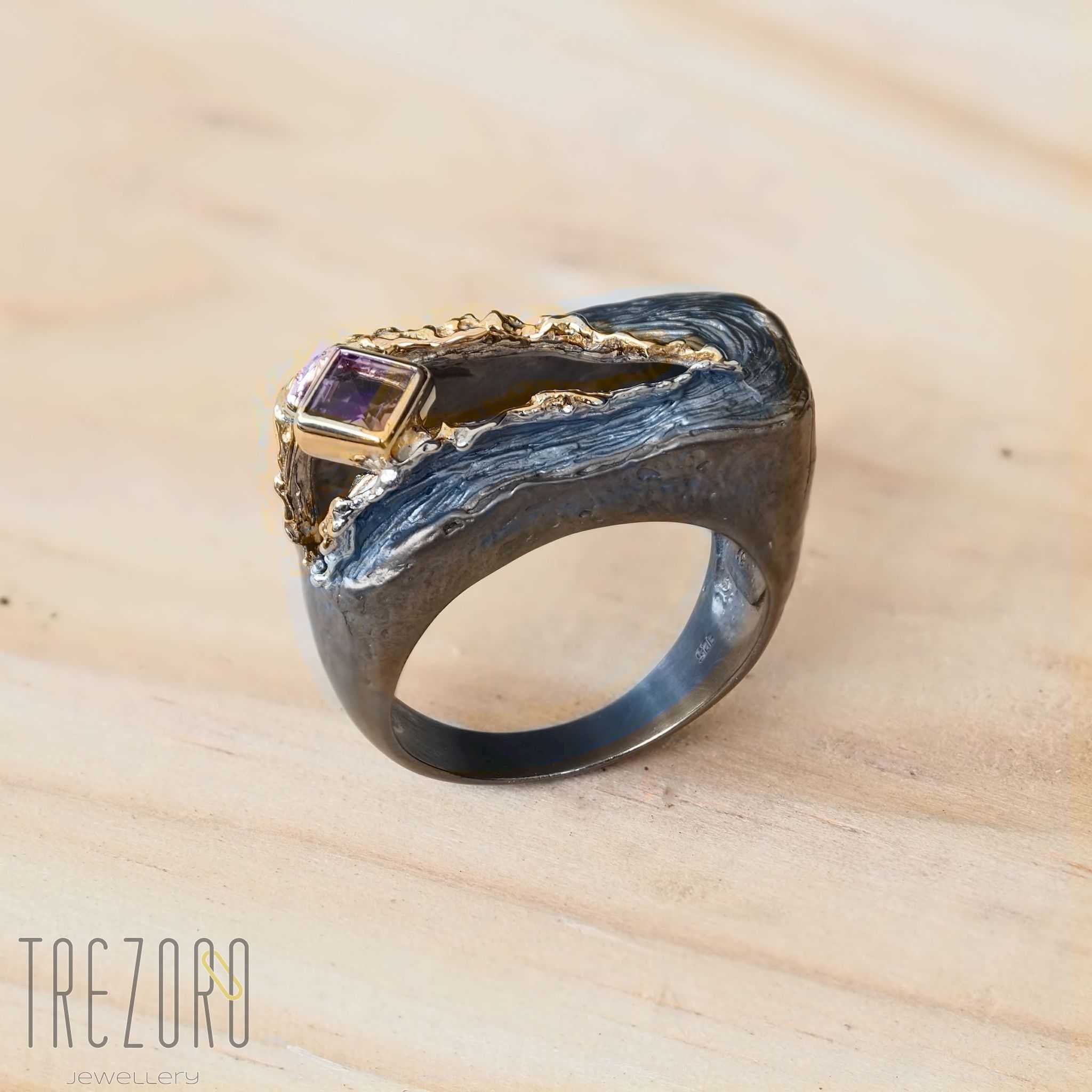 Amazing Surprise Ring. Oxidised and  Gold Plated Sterling Silver wih natural Amethyst. On wood.