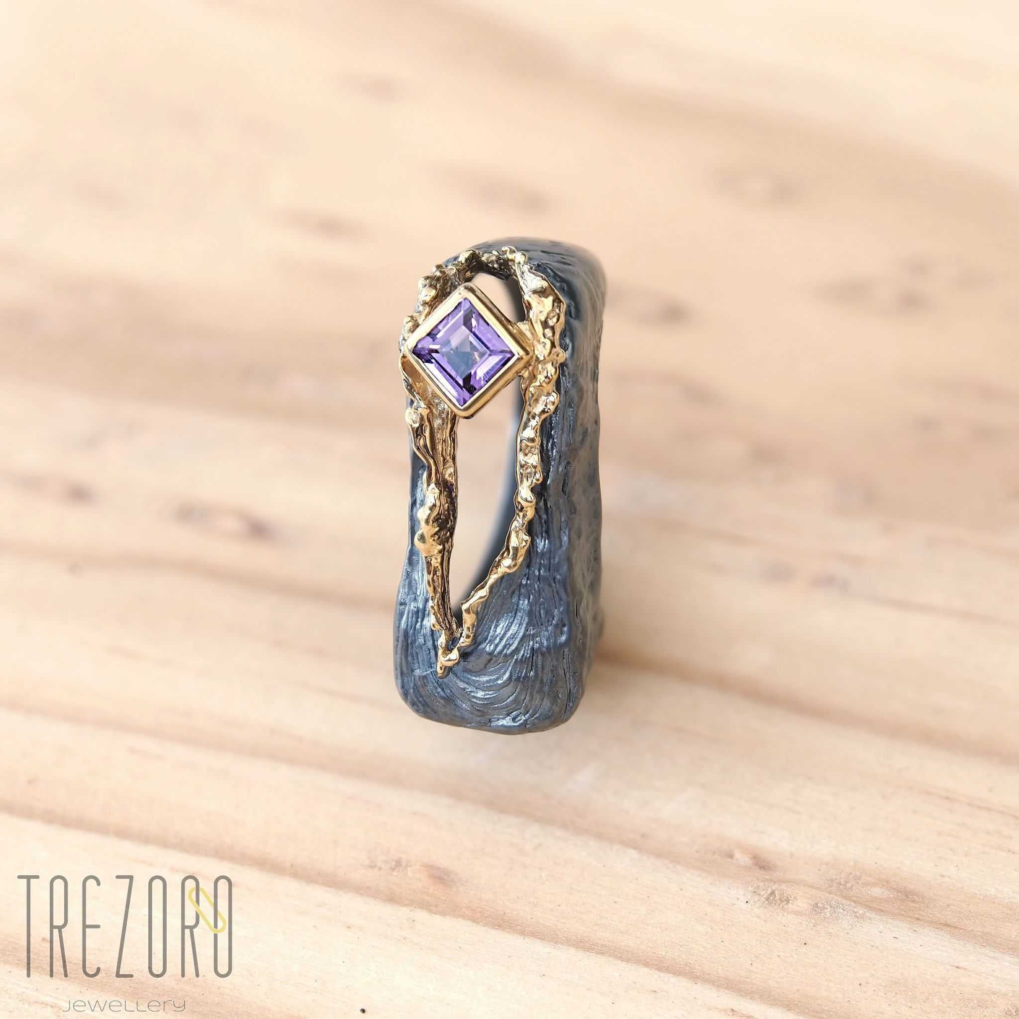 Amazing Surprise Ring. Oxidised and  Gold Plated Sterling Silver wih natural Amethyst. On wood 3.